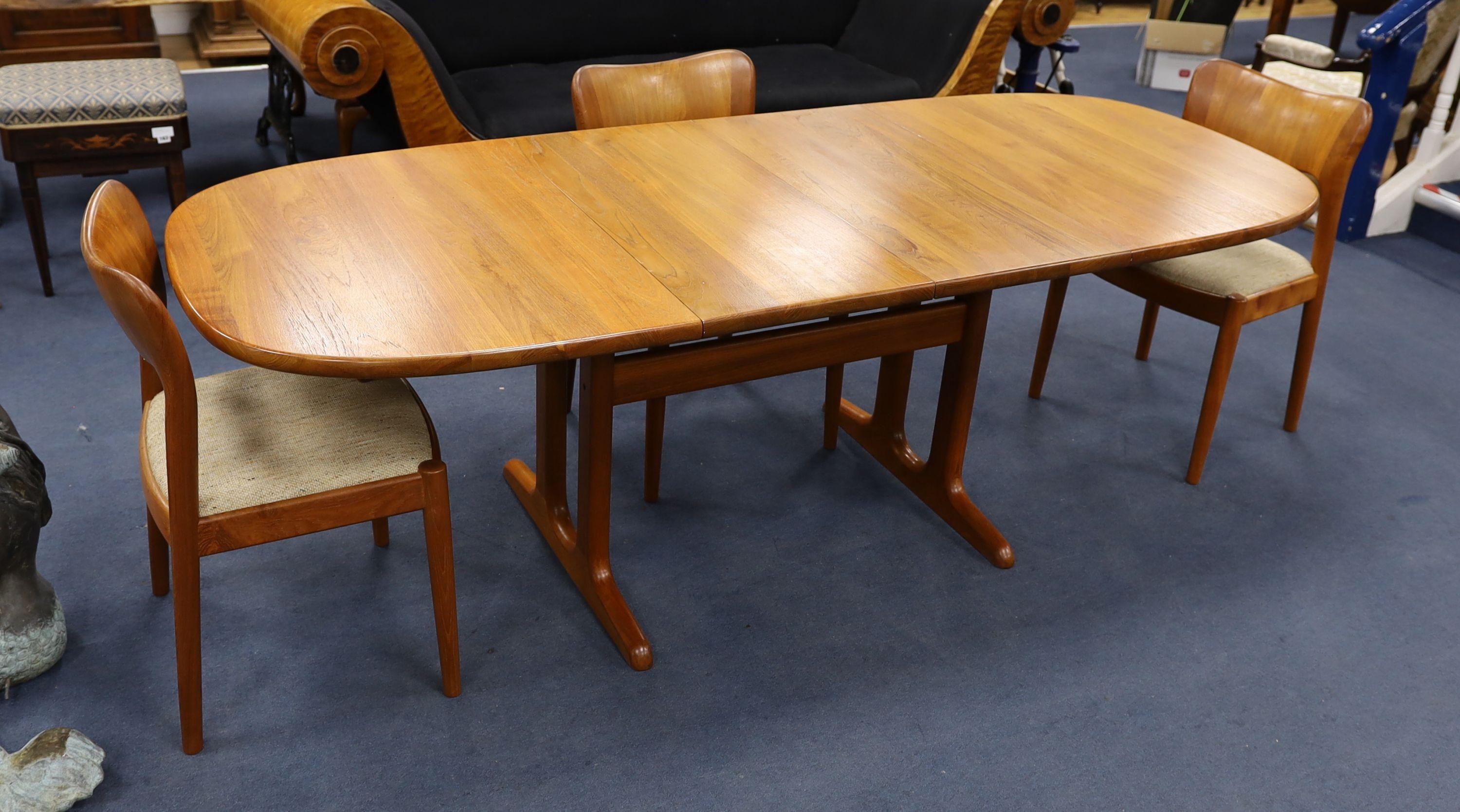 Mid century design. A Niels Koeford Danish teak extending dining table and four chairs, 222cm extended, width 89cm, height 73cm